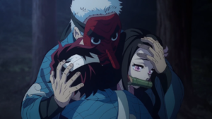 Sakonji embraces Tanjiro and Nezuko.