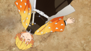 Zenitsu unconscious after falling out of the Drum House